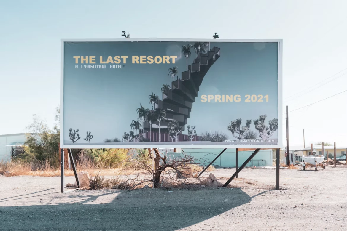 Large roadside billboard showing a hotel campaign ad